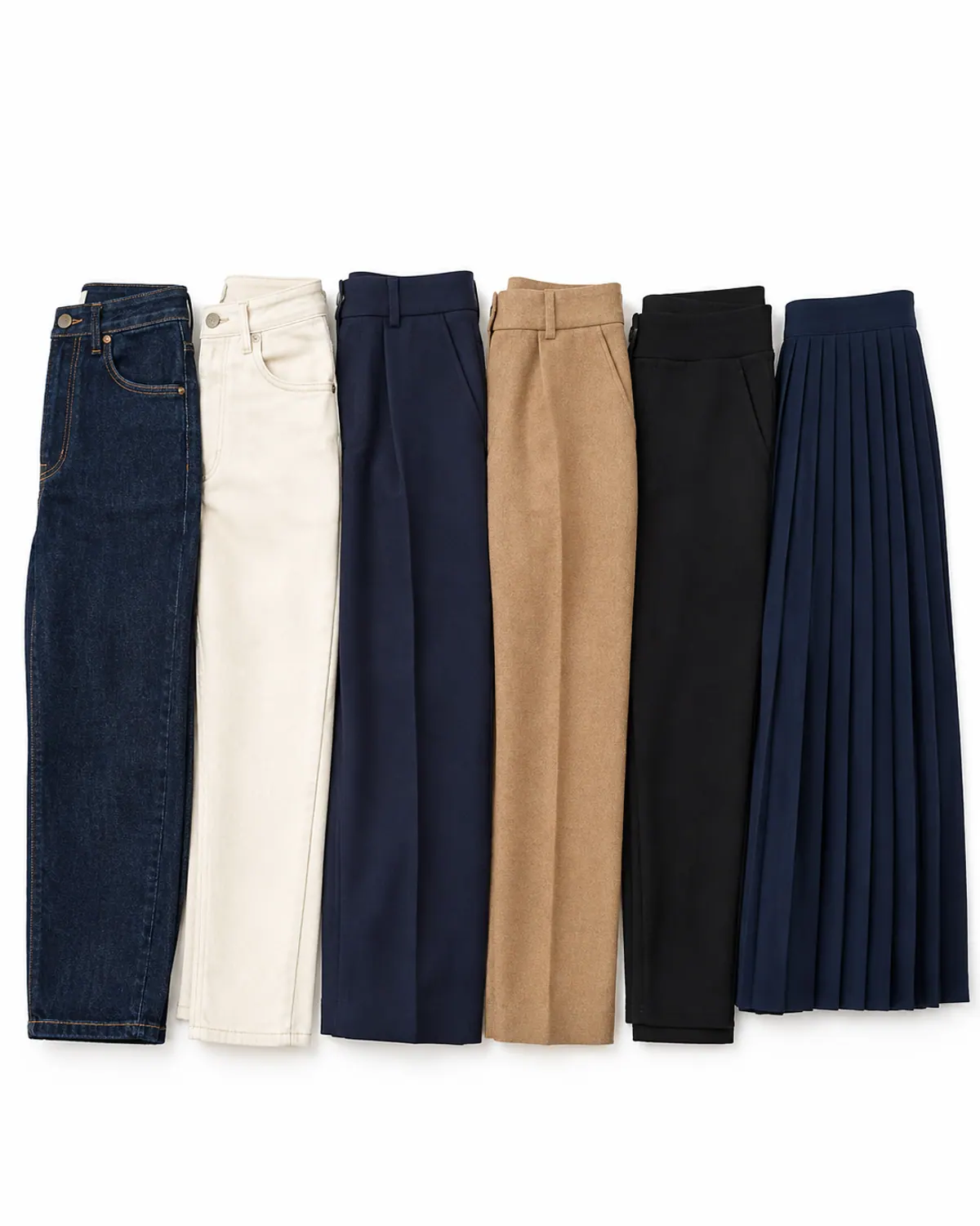 Six winter capsule wardrobe bottoms side by side: dark jeans, ecru jeans, navy wide-leg trousers, camel trousers, black pull-on pants and a navy pleated midi skirt
