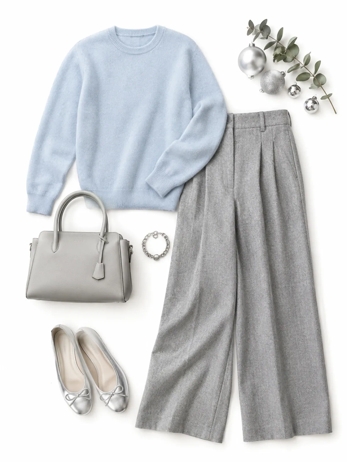 Christmas outfit with no red: an icy blue sweater, light grey flannel wide-leg trousers, silver ballet flats, a silver bracelet and a pale grey handbag on white linen with silver ornaments