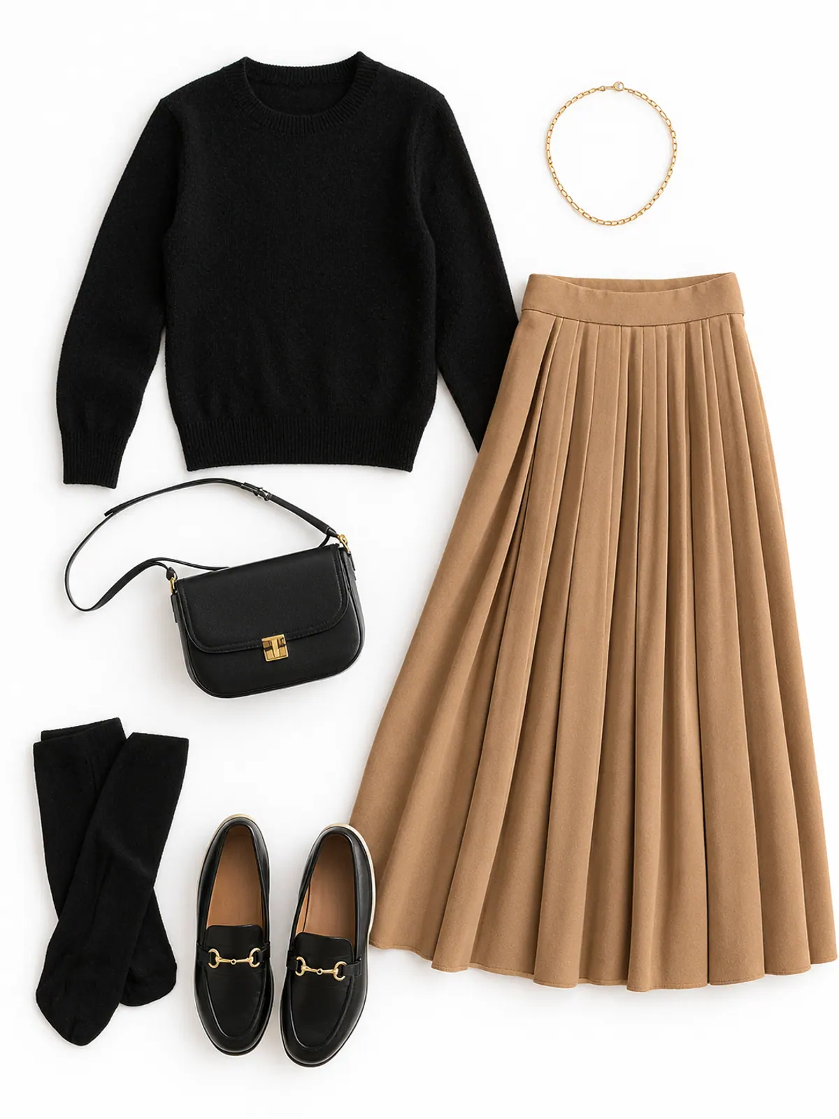 Classy casual outfit flat lay of a camel pleated midi skirt, black fine-knit sweater, black loafers, black opaque tights and a gold chain necklace on cream linen